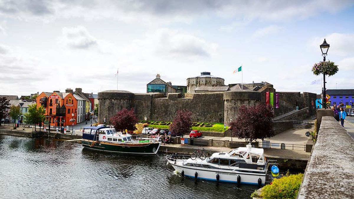 Boats cruising past Athlone Castle in Westmeath