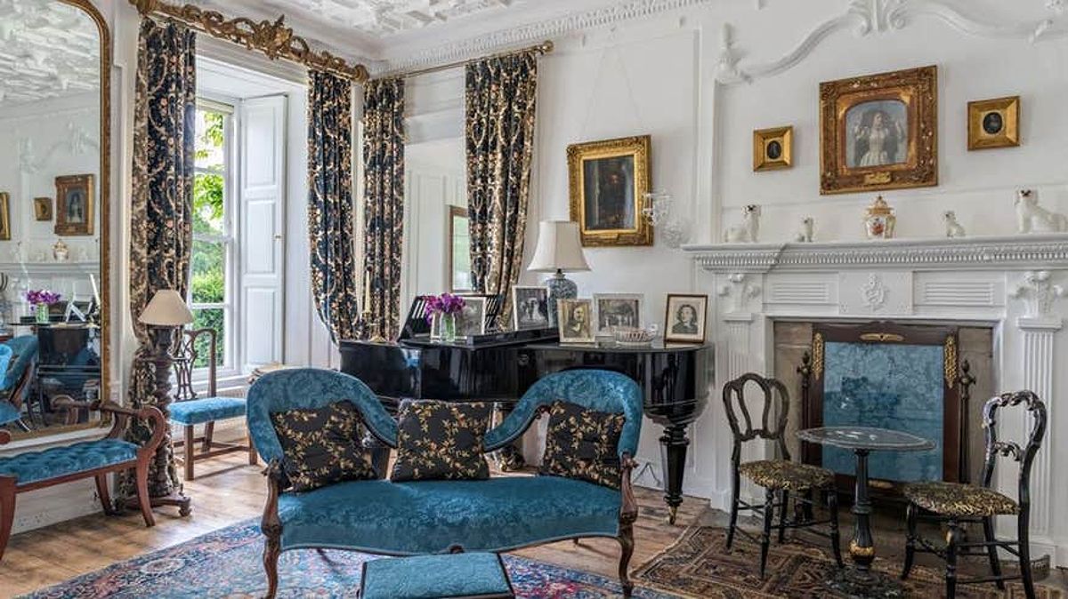 Interior of Huntington Castle with blue chairs and white walls