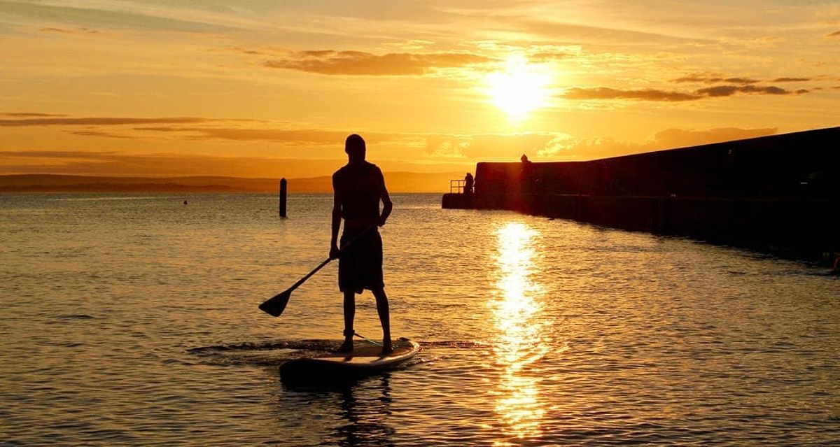 Stand up paddling at Enniscrone, Co. Sligo with Harbour SUP